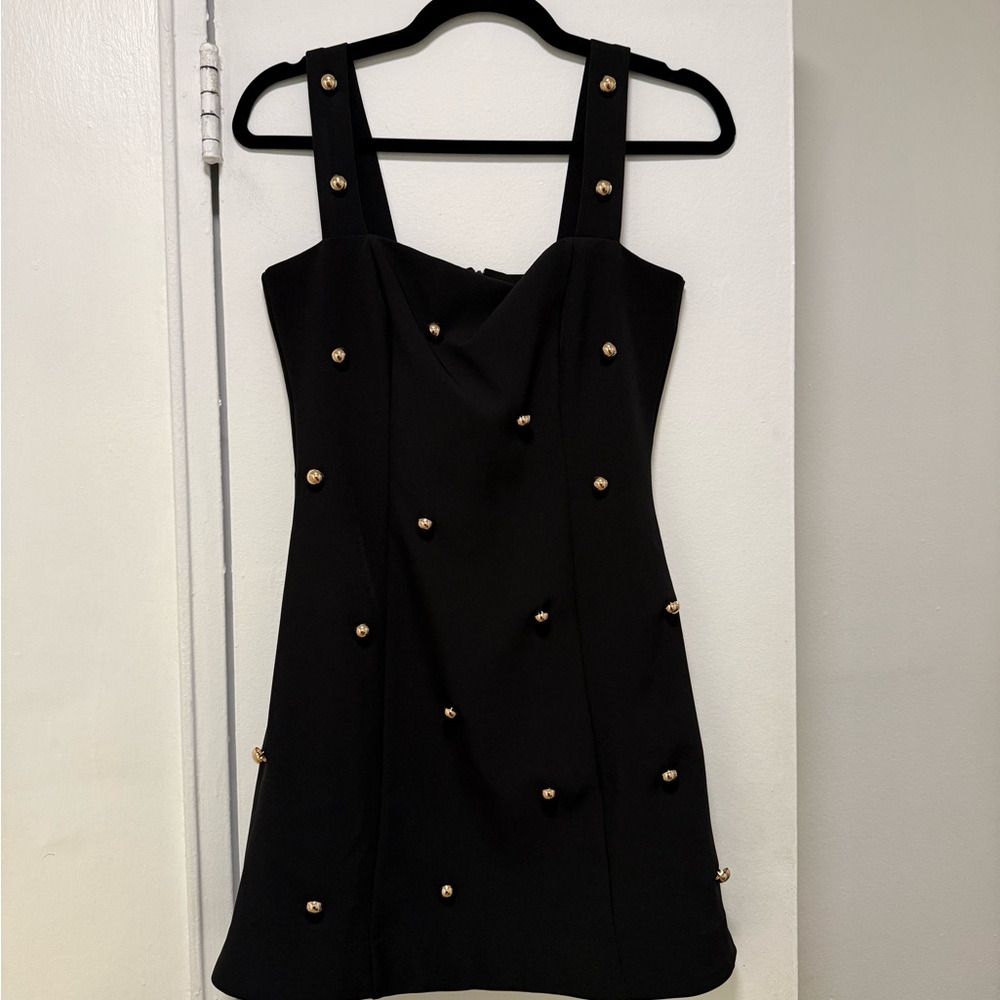 Chic Black Mini Dress with Gold Details